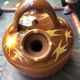 Orange glazed terracotta gargoulette