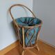 Wicker worker round basket with work, knitting