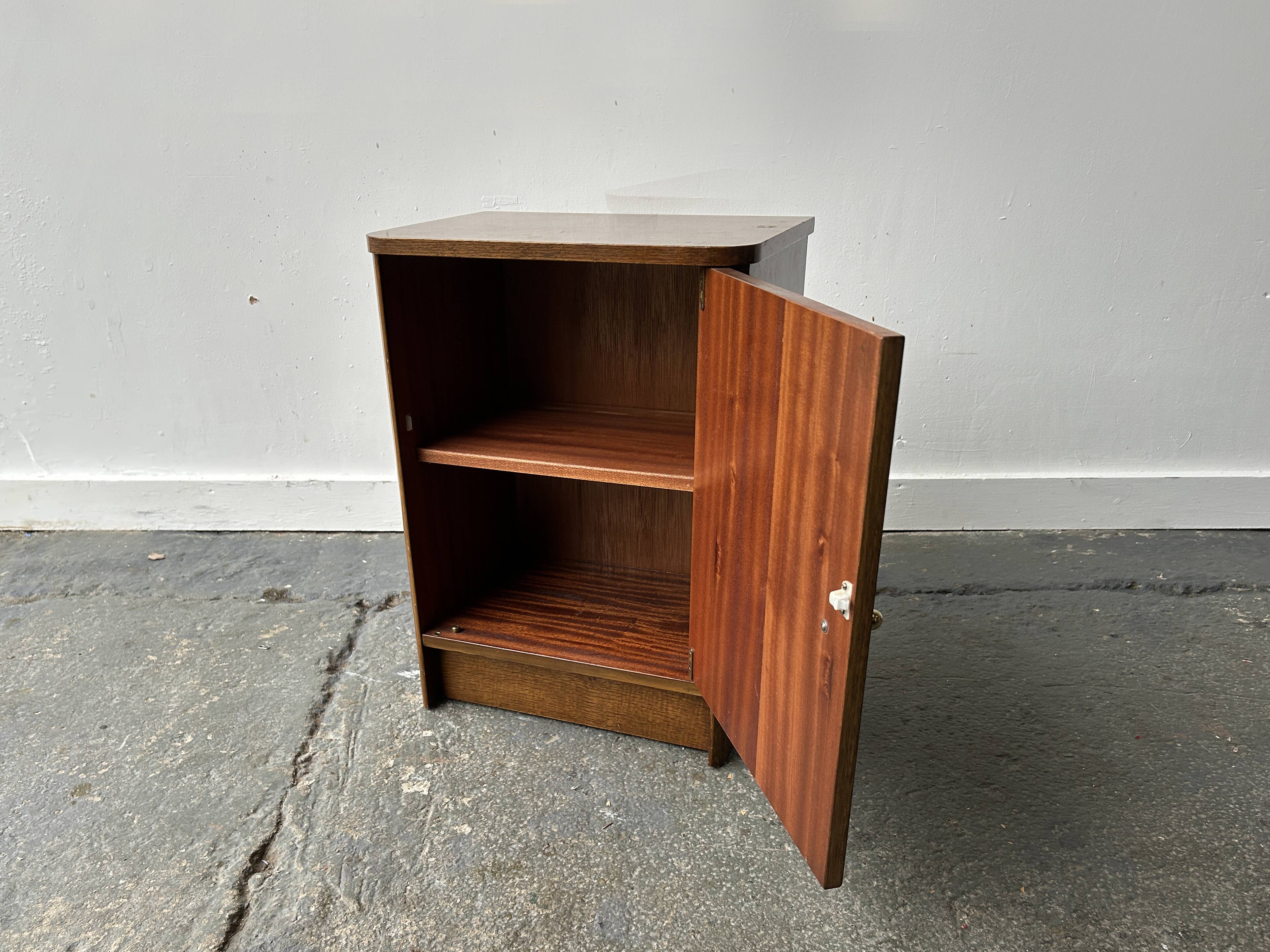 A vintage 1950/60s petite compact oak bedside cabinet