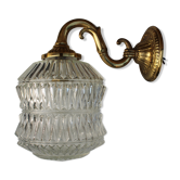 Brass wall light and streaked glass