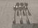 6 individual silver-plated metal sauce spoons with hammered baguette handles