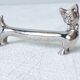 Silver metal dogs, 12 knife holders excellent condition
