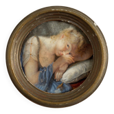 19th century miniature of a young girl with her head resting on a cushion