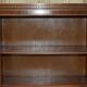 Corner library made of flamed hardwood, in 3 parts.