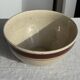 Large speckled beige salad bowl with ochre trim H14 D25
