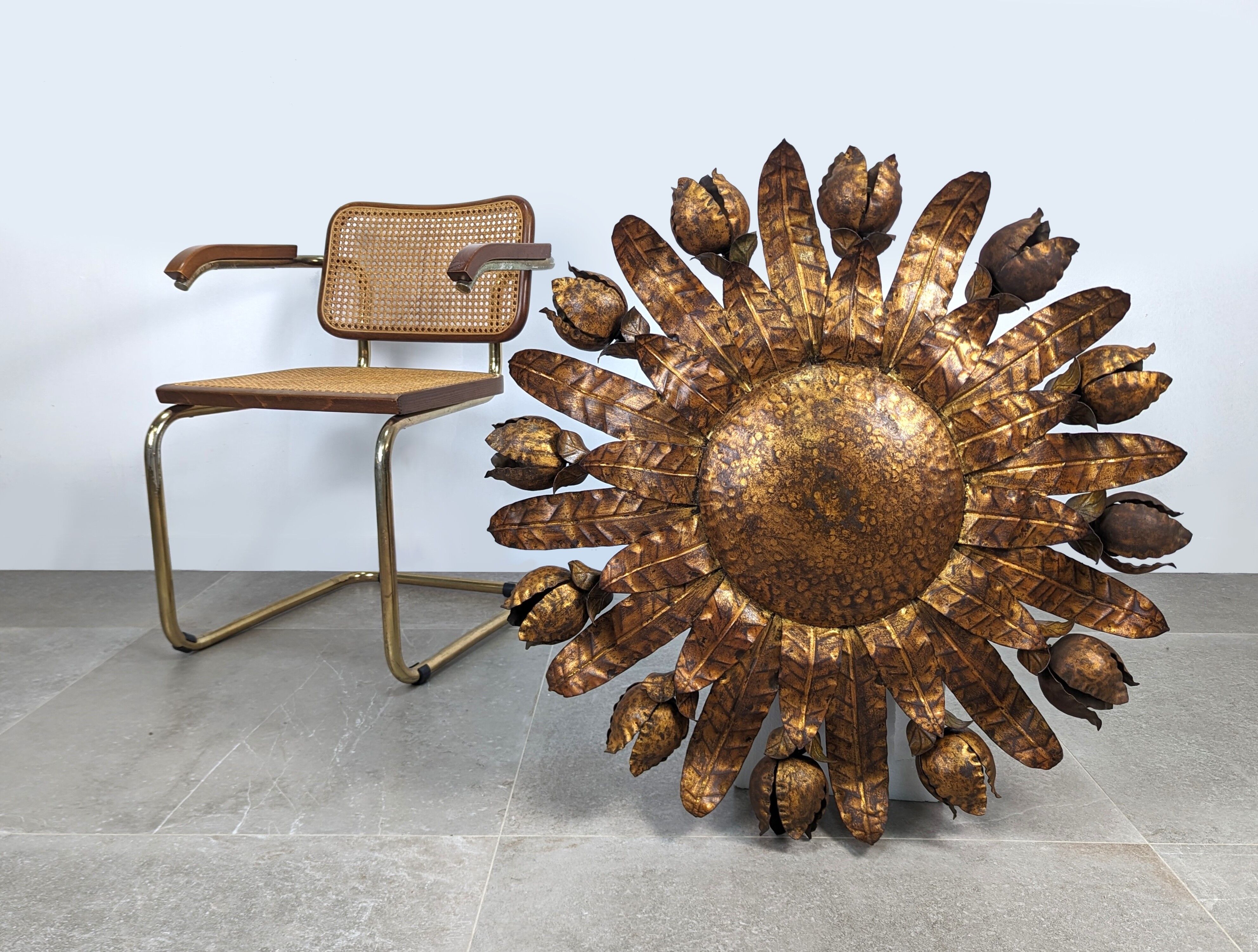 Large mid-century sunburst ceiling lamp, gilded metal with floral motif, 1950s
