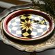 Vintage decorative plate in red, black, and gold metal, Poland, 1960s.
