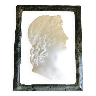 Profile of a young man in the style of antique marble.