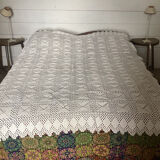 White cotton crochet bedspread with squares