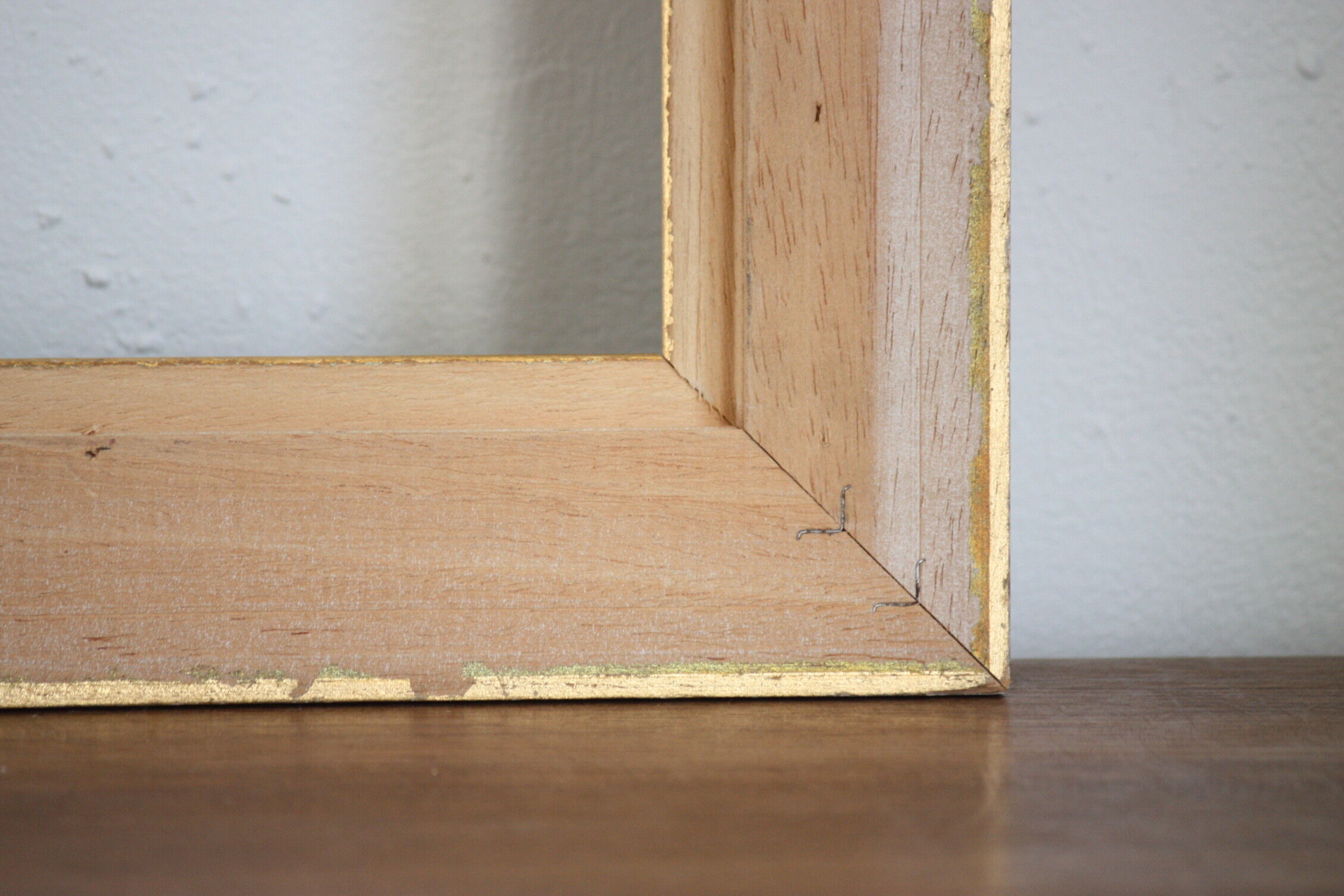 Frame in gilded and green wood