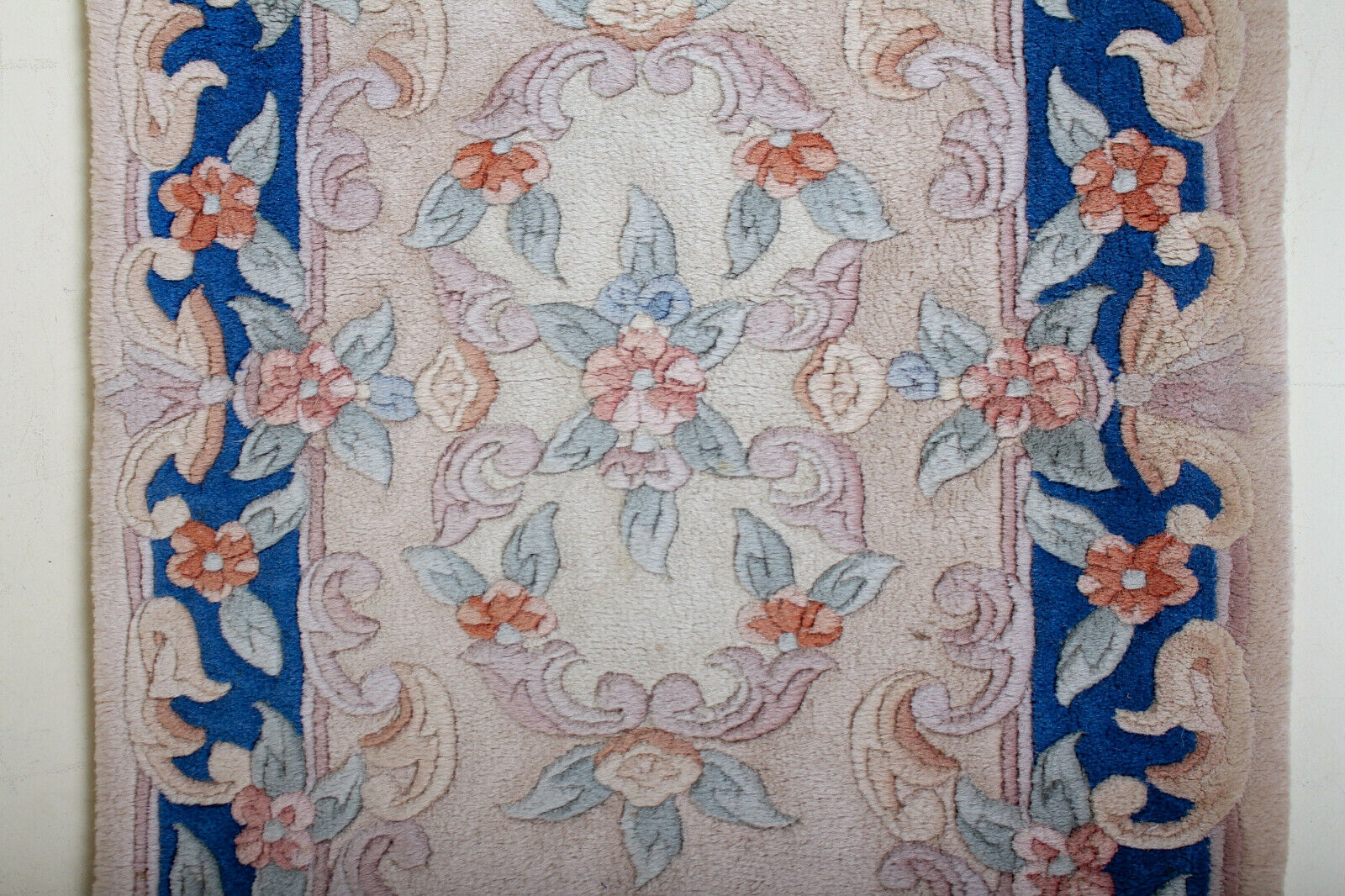 Chinese fringe rug with floral pattern on blue and beige background 63x143cm