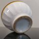 Authentic Vintage ceramic faceted bowl decorated with a double border