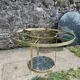 Round dining table with green marble and solid brass.
