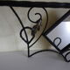 Wrought iron wall holder with top support and built-in mirror