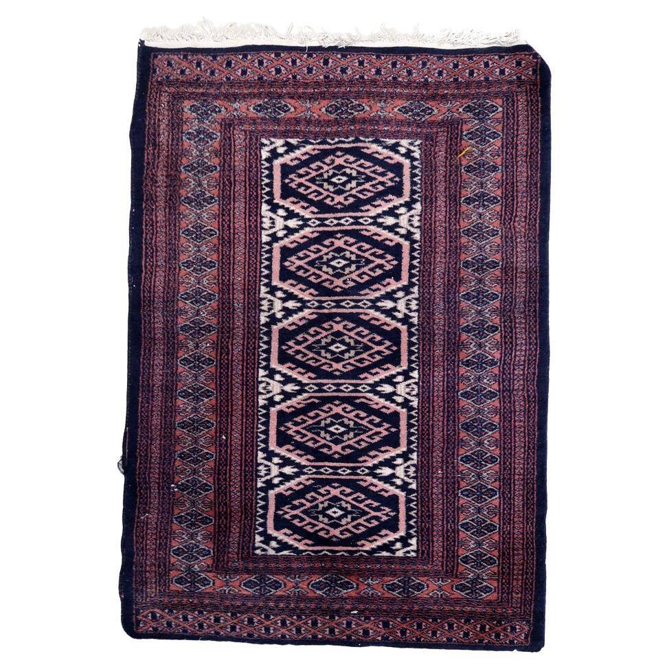 Handmade vintage 1960s Uzbek Bukhara rug – small wool tribal carpet (65cm x 95cm)