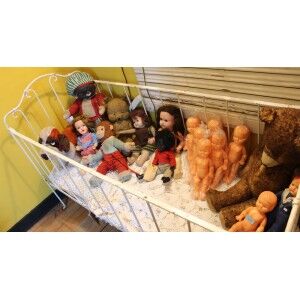 Vintage children's bed with white patina
