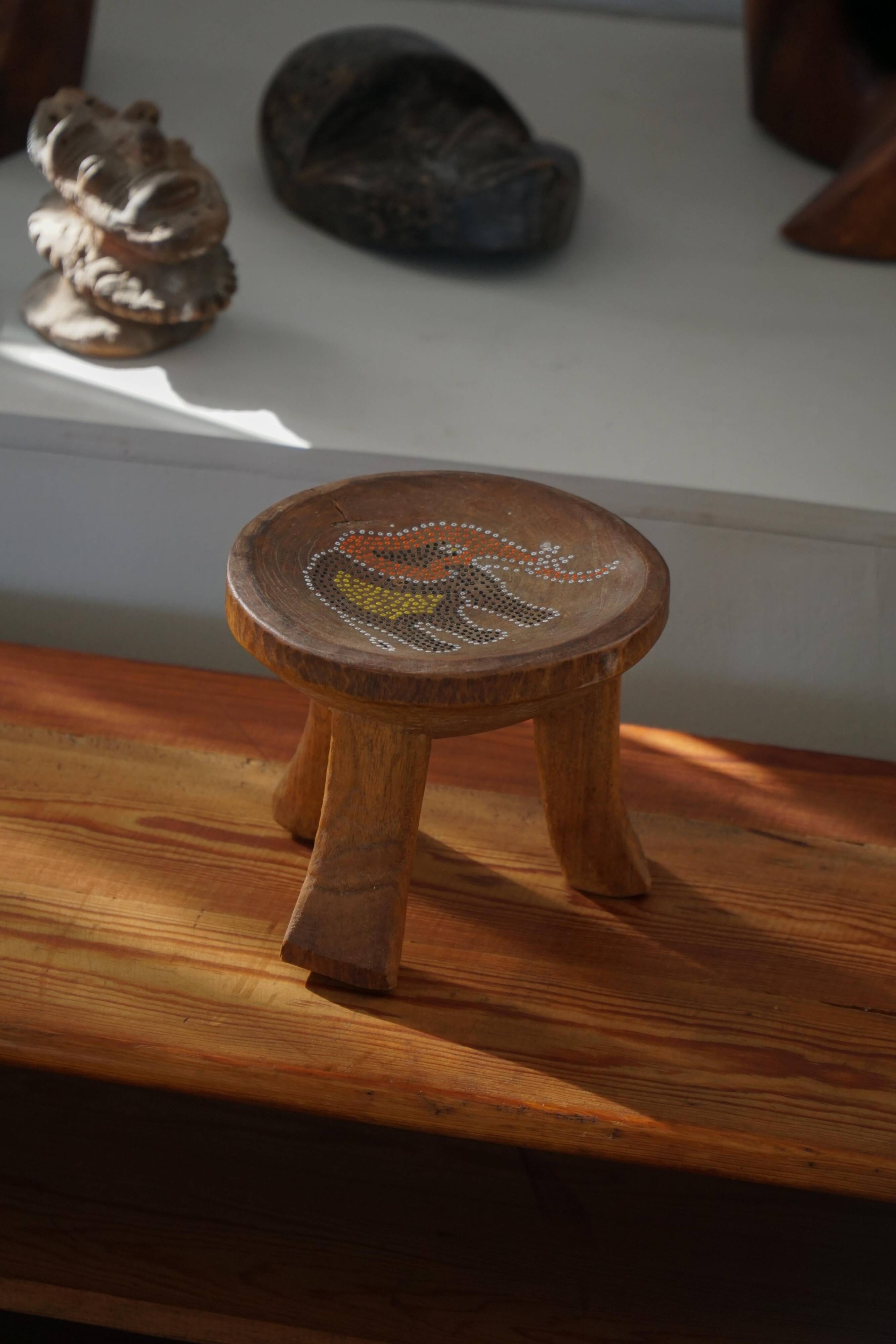 Small tripod stool Kamba hand-carved, elephant motif, Kenya, mid-20th century.