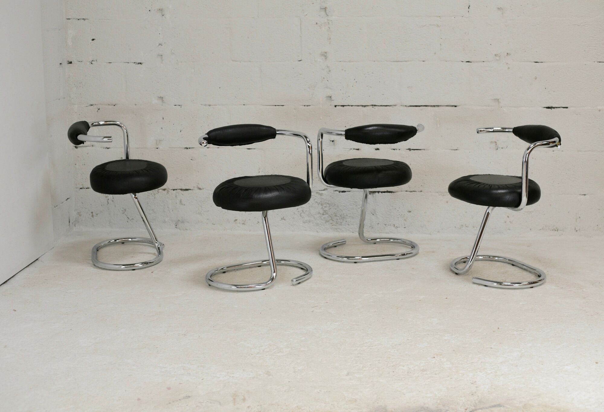 4 chairs tubular steel, imitation black leather, Italy, circa 1970