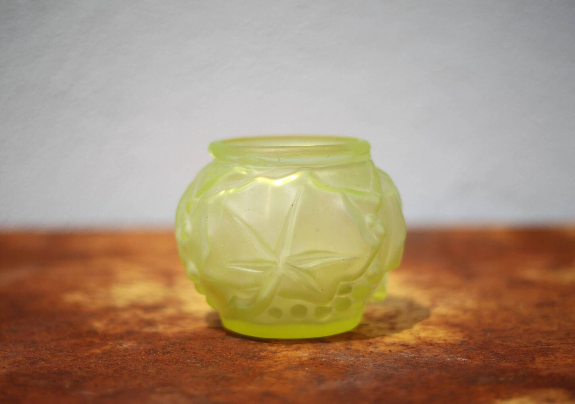 Fluorescent yellow ball vase with vine leaf patterns