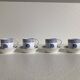 4 coffee cups and saucers