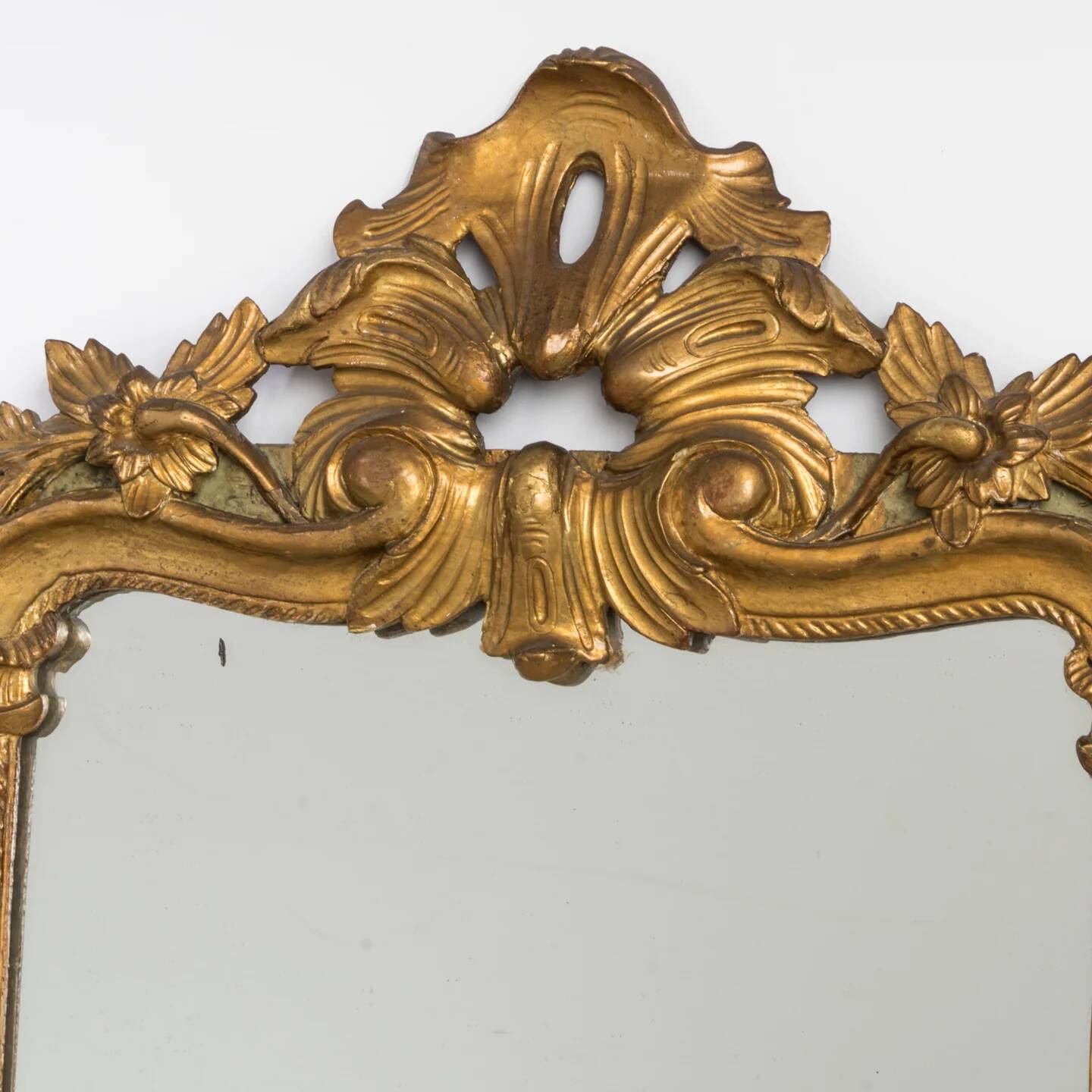 Antique flowered mirror from the 19th century.