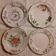 Set of four retro fruit and flower flat plates from Moustiers...