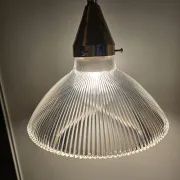 Vintage globe-style holophane on a chrome stem.