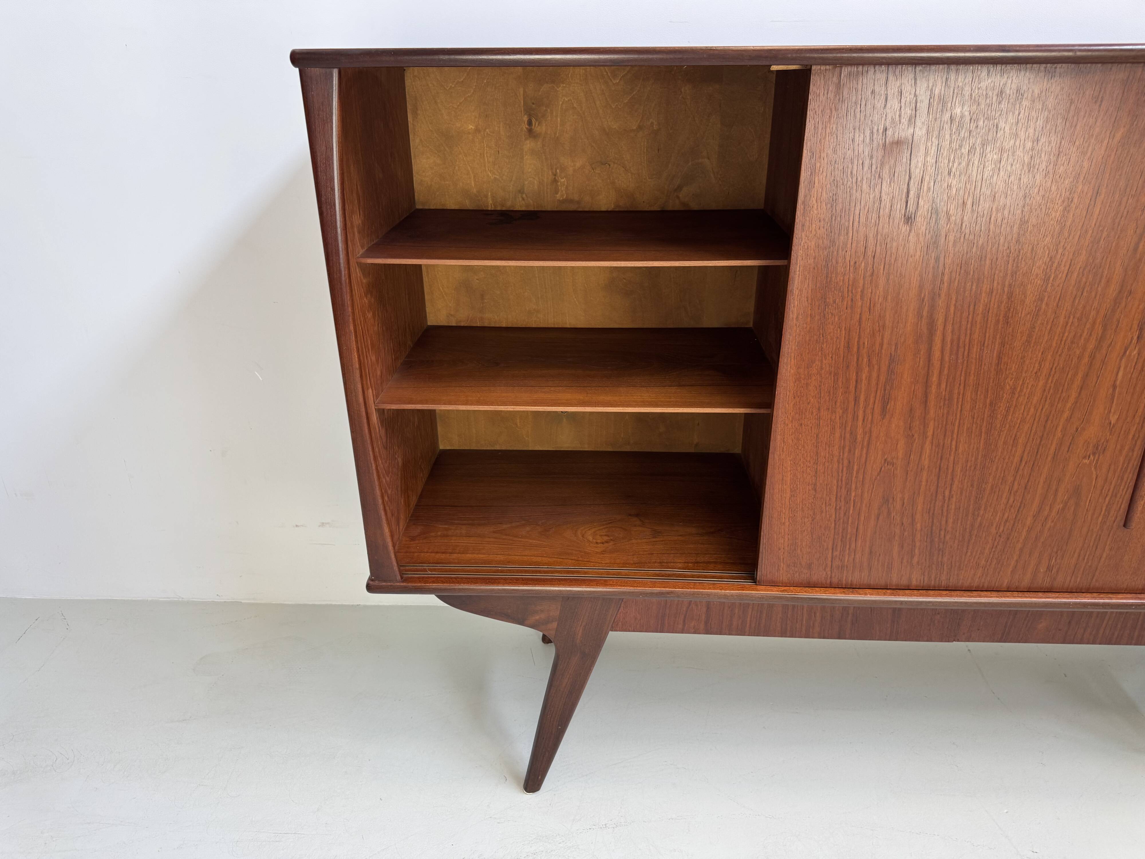 Vintage Danish teak wall unit with sliding doors from the 1960s.