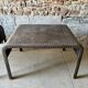 Pair of large riveted metal industrial tables