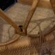 Vintage rattan baby cot on wheels.