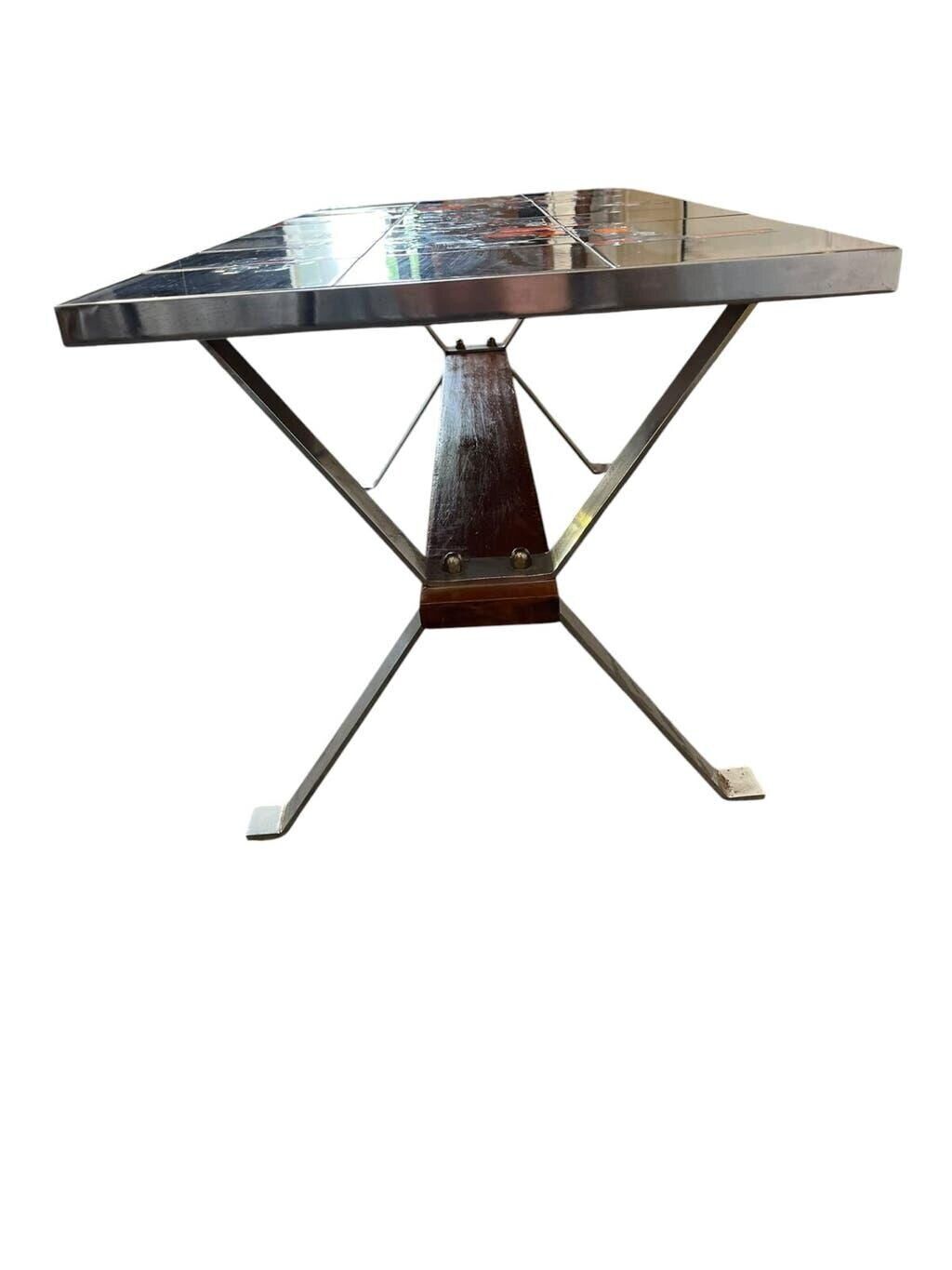 Vintage ceramic coffee table with chrome and wood accents.