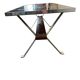Vintage ceramic coffee table with chrome and wood accents.