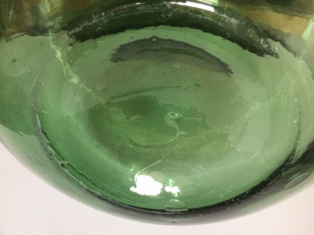 Demijohn old transparent green, estimated capacity around 12 to 15L