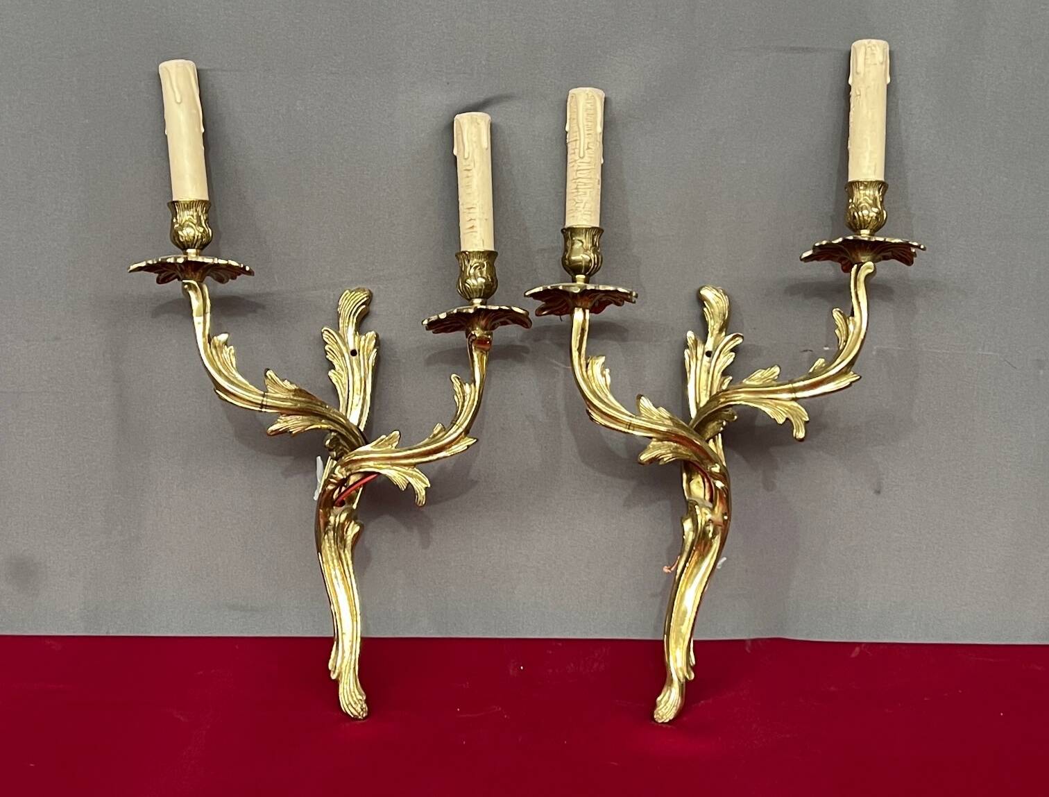 Pair of solid gilded bronze wall lights.