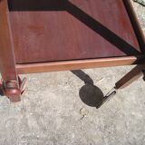 A rolling table with a removable tray