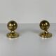 Pair of Guzzini brass spherical wall lights, 1970