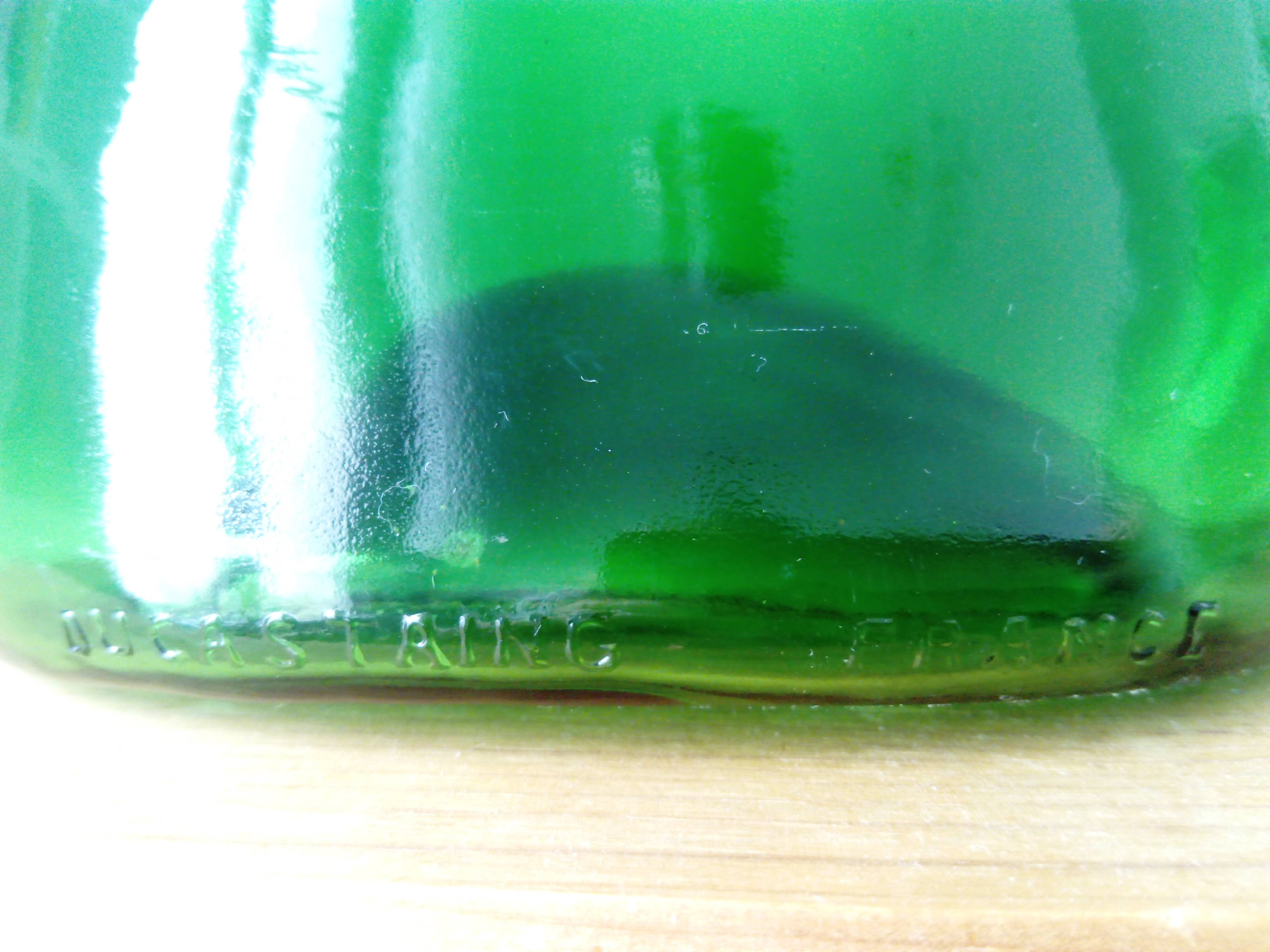 Old blown glass bottle, free form. Armagnac