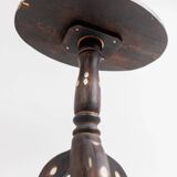 Vintage side table from the early 19th century, dark wood with mother-of-pearl inlays, oval shape with three legs, ethnic style.