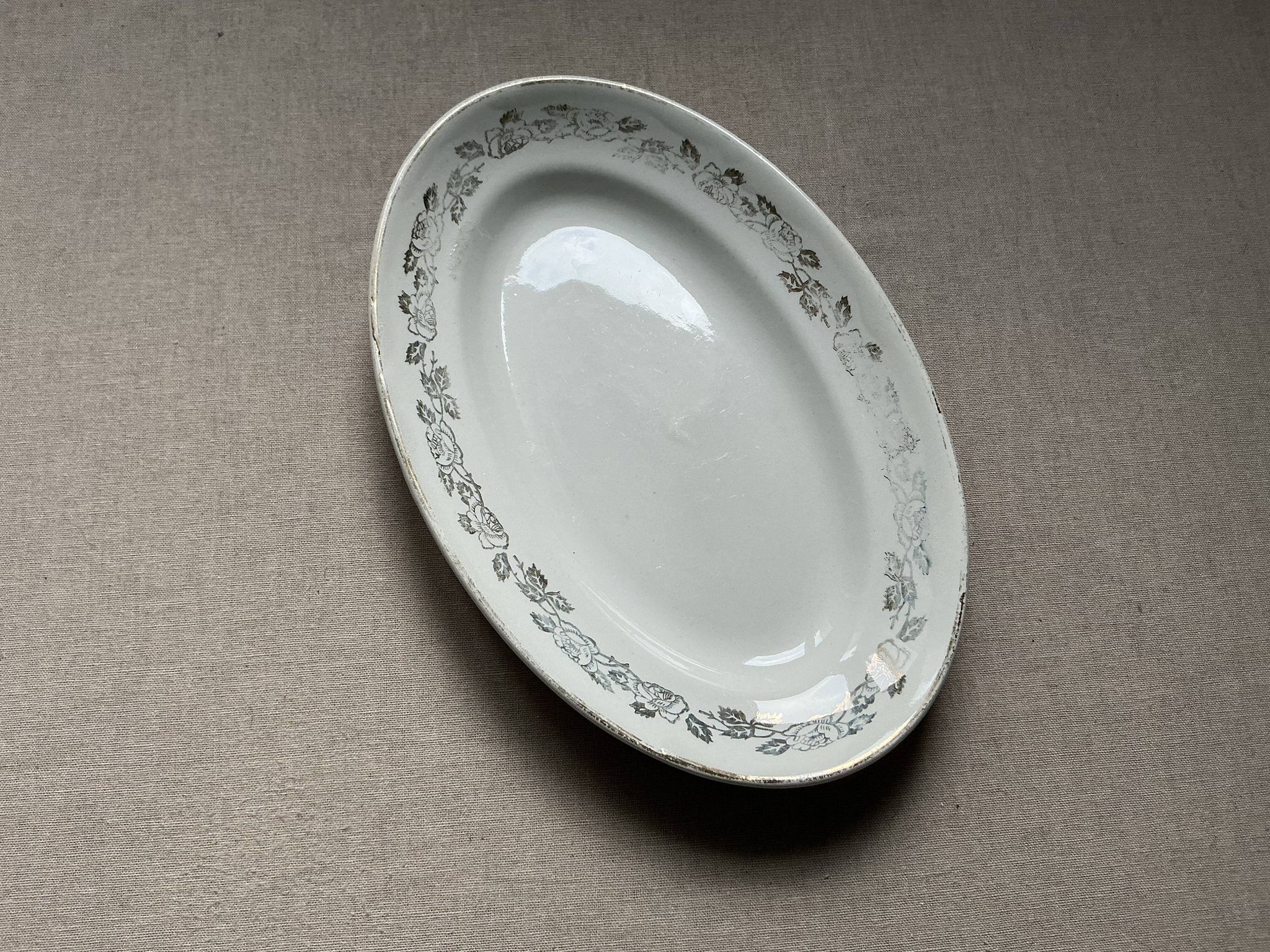 Antique oval plate Moulin des Loups Orchies – grey and gold floral decoration