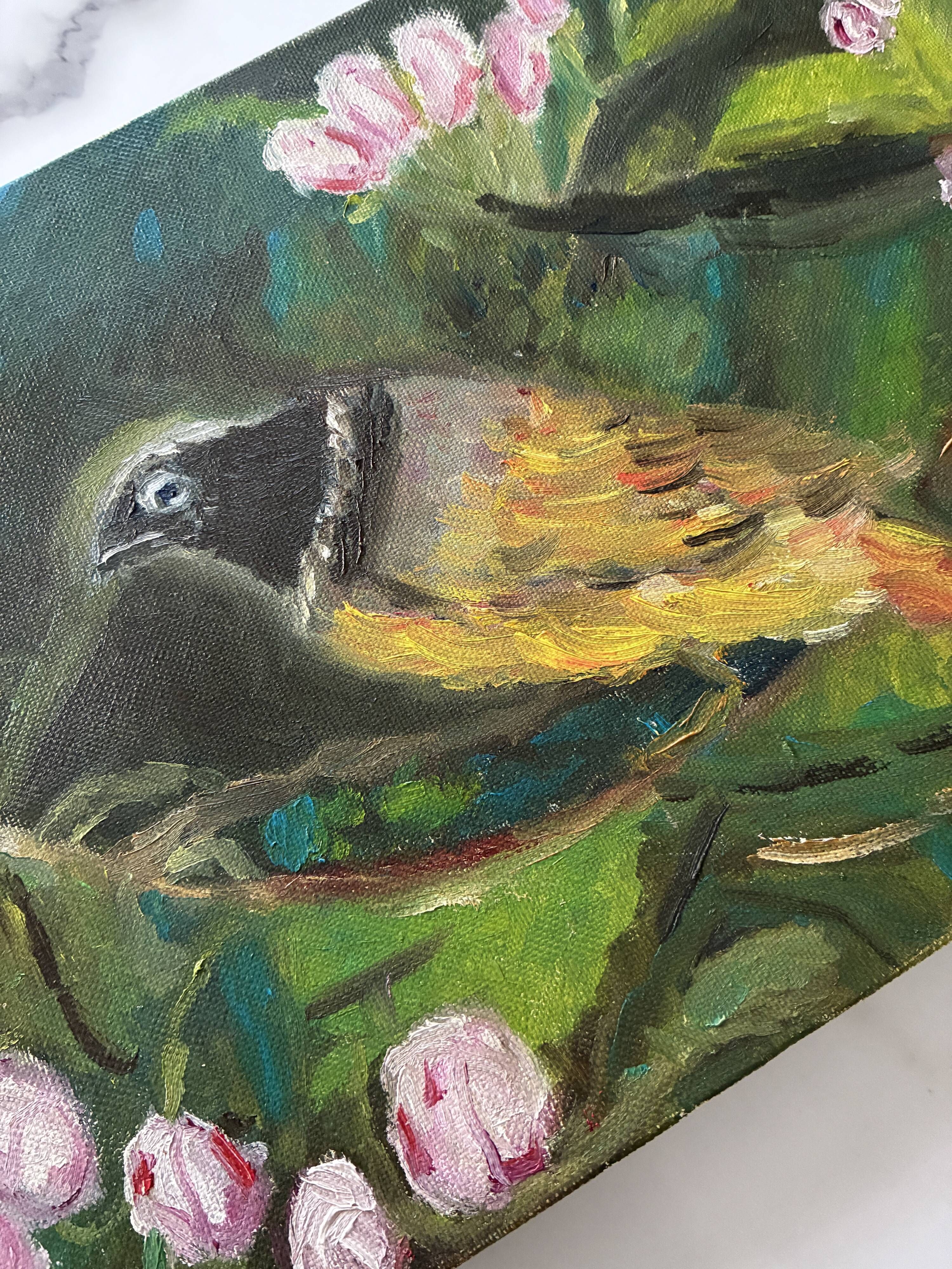 Oil painting still life of a goldfinch.