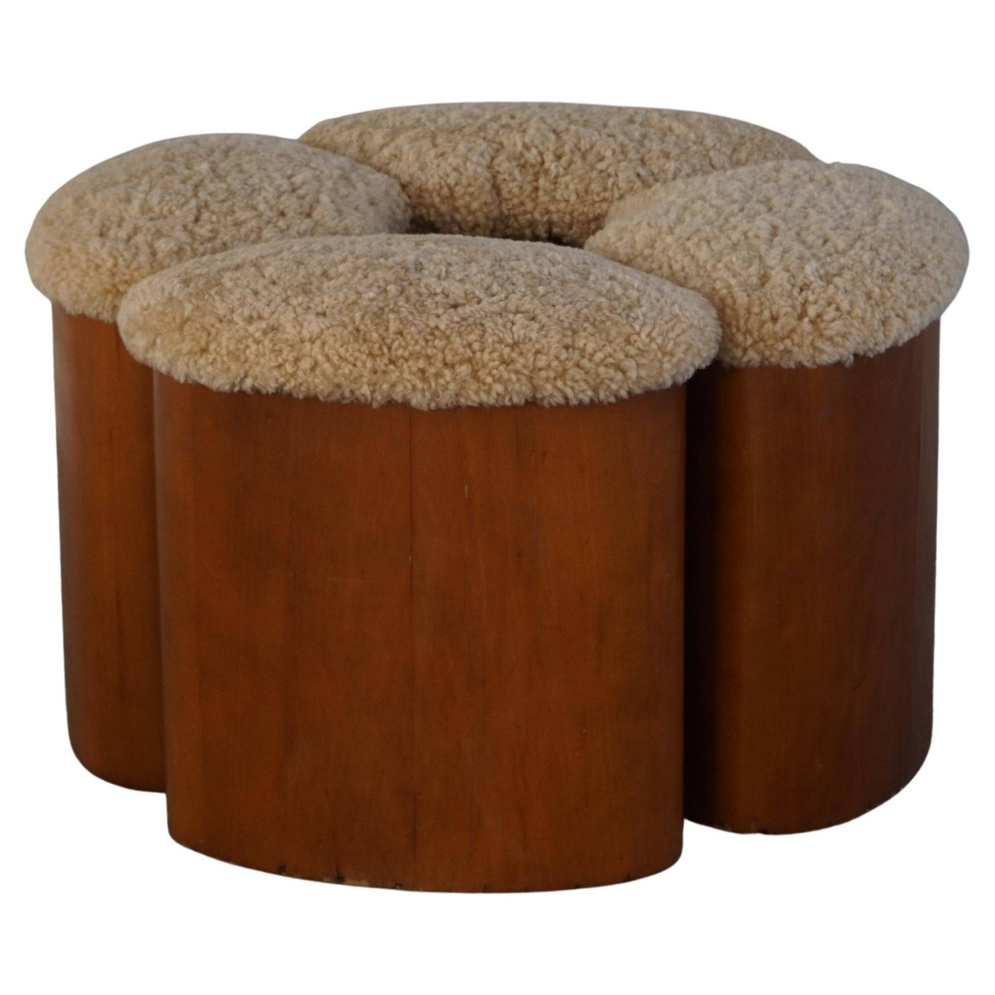 Set of 4 sculptural French Art Deco stools in wood and lamb's wool, 1940s.