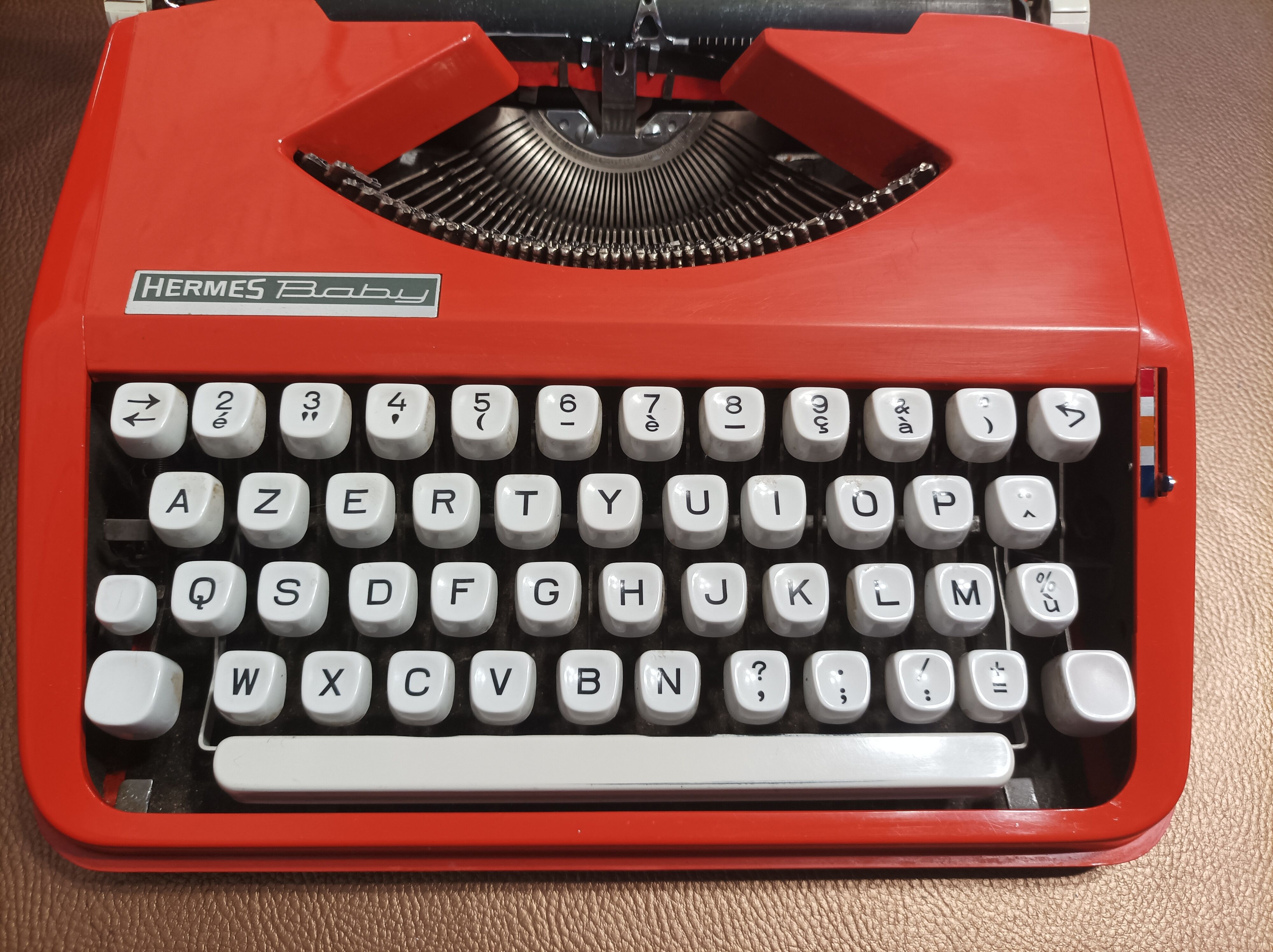 Hermes baby orange typewriter