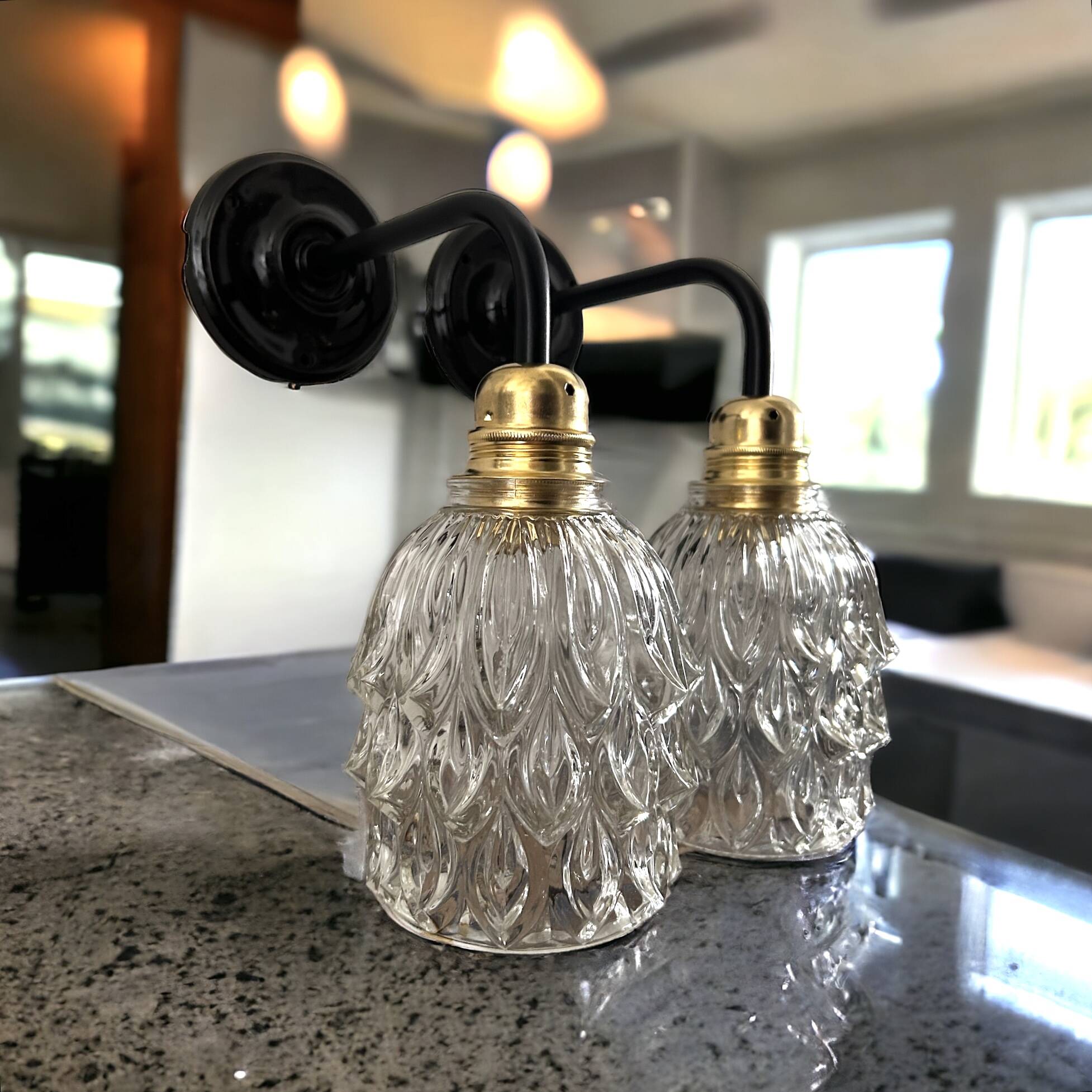 Pair of chiseled glass wall sconces