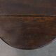 Antique English drop-leaf joint stool made of oak from the 18th century