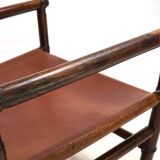 Manou rattan armchair with leather seat, 1960