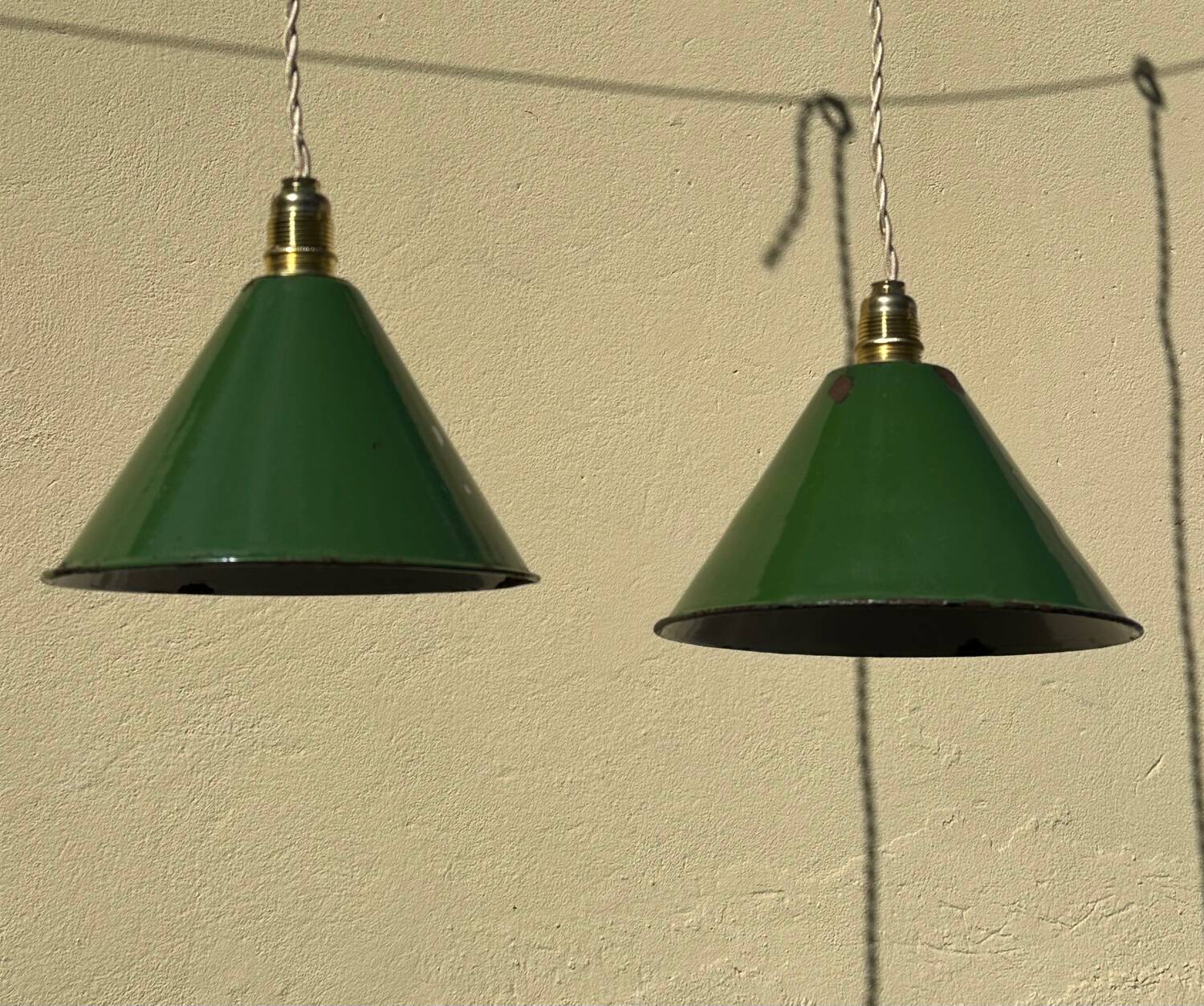 Pair of vintage industrial retro conical enamelled sheet metal pendant lights