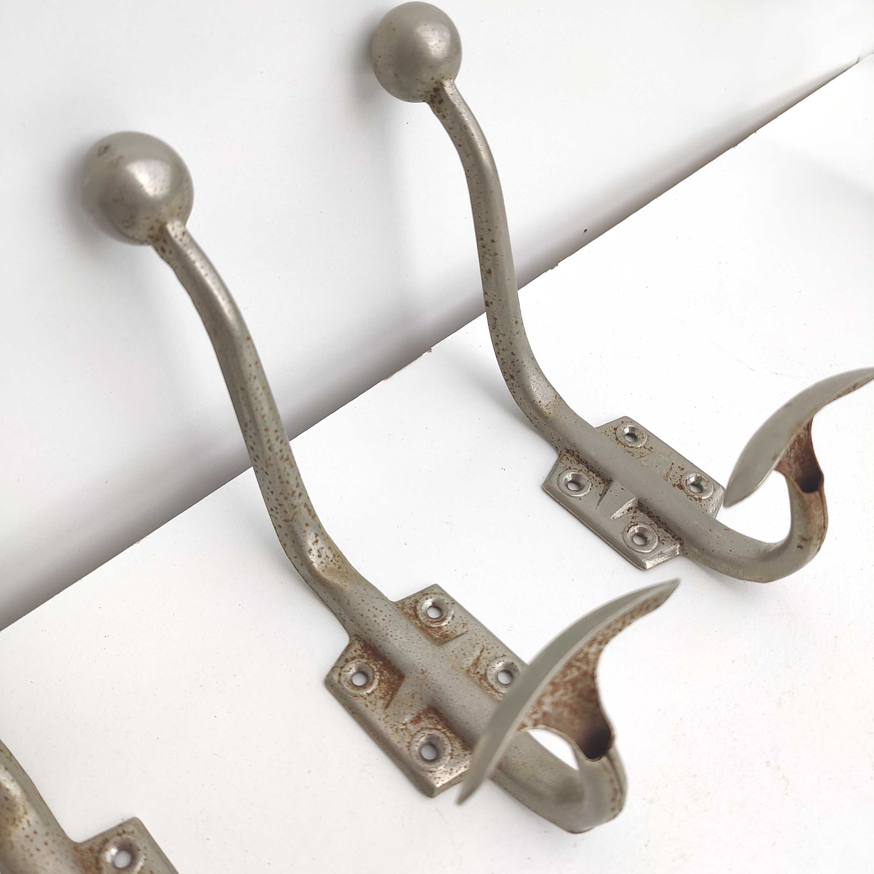 Three metal hooks