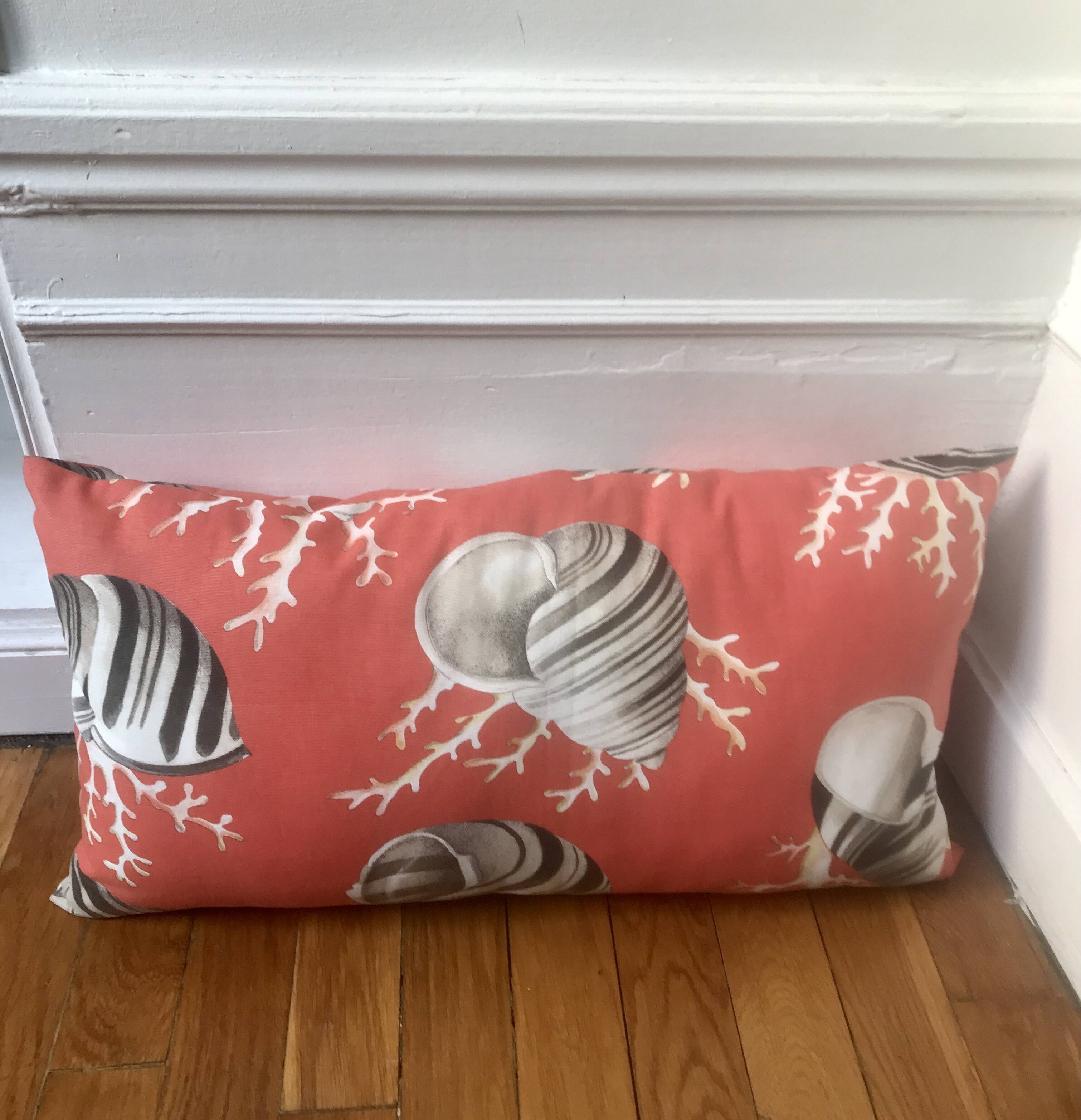 Coral and shell cushion