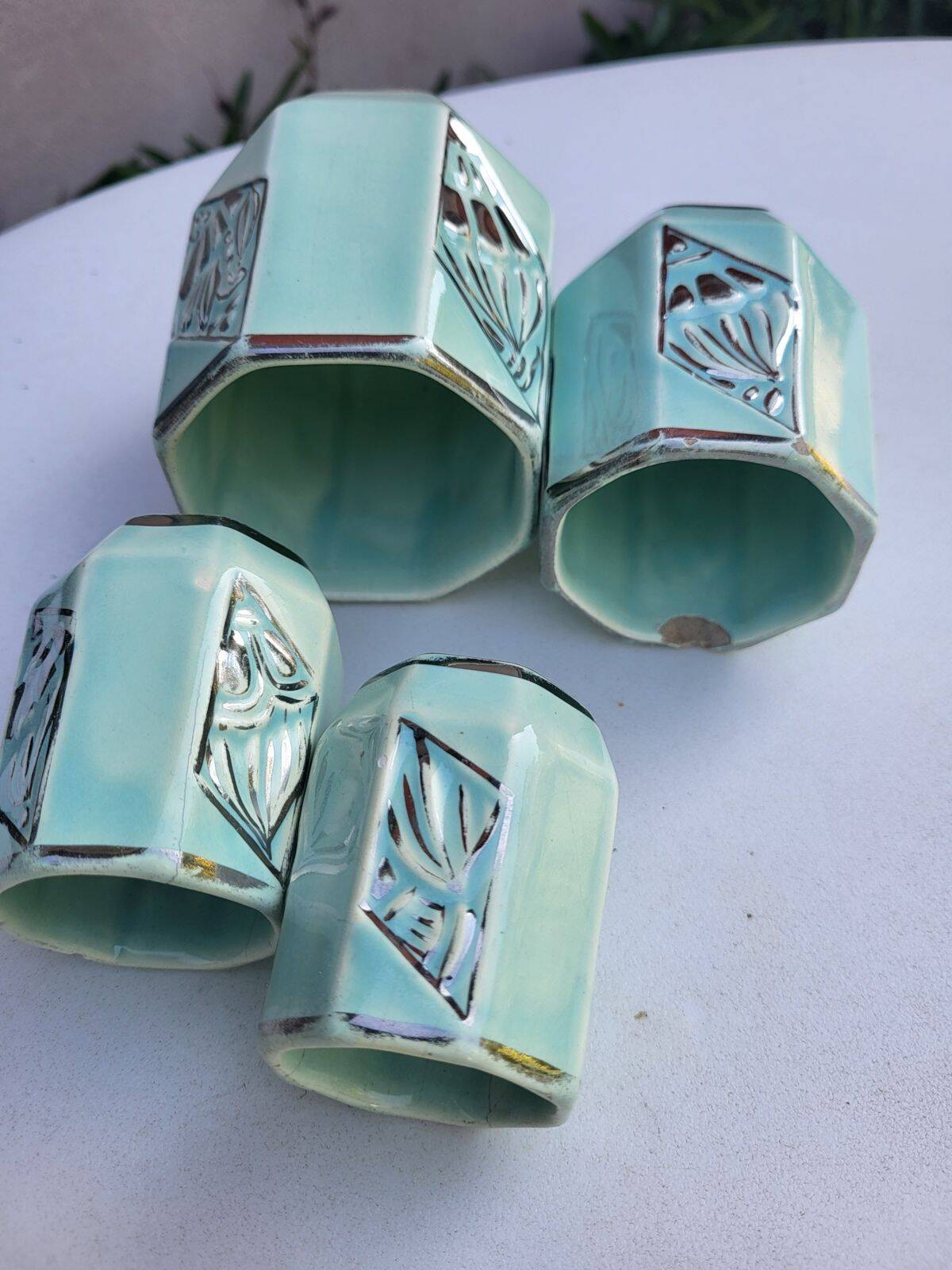 Set of 4 Art Deco celadon green and silver barbotine pots.