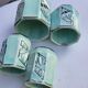 Set of 4 Art Deco celadon green and silver barbotine pots.
